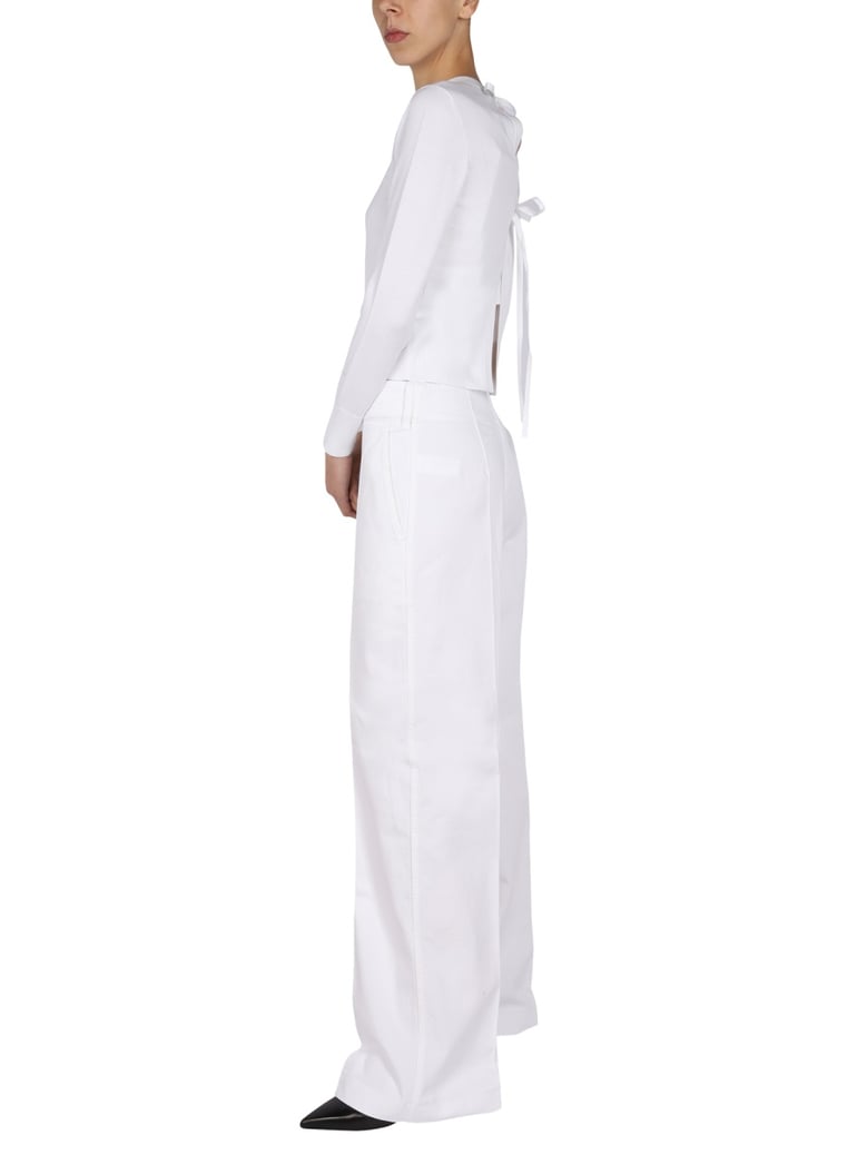 swirl back bow jersey knit top by Selfnex