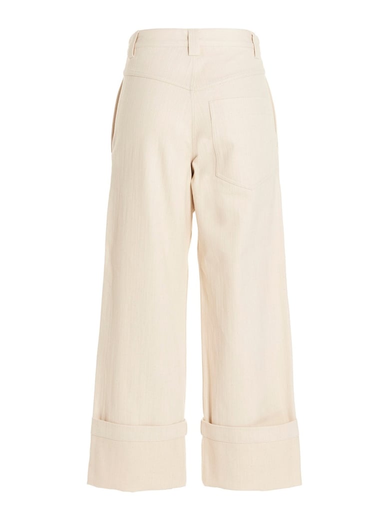 flared pants with zipper closure by Selfnex
