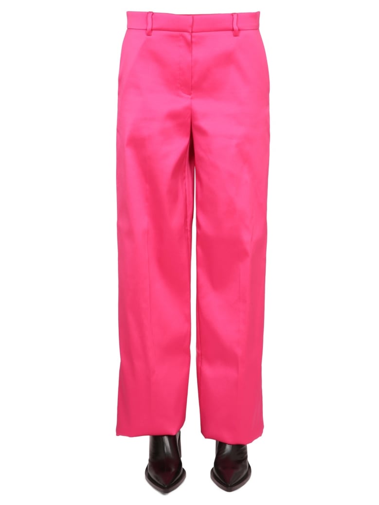 wide leg pants in fuchsia by Selfnex