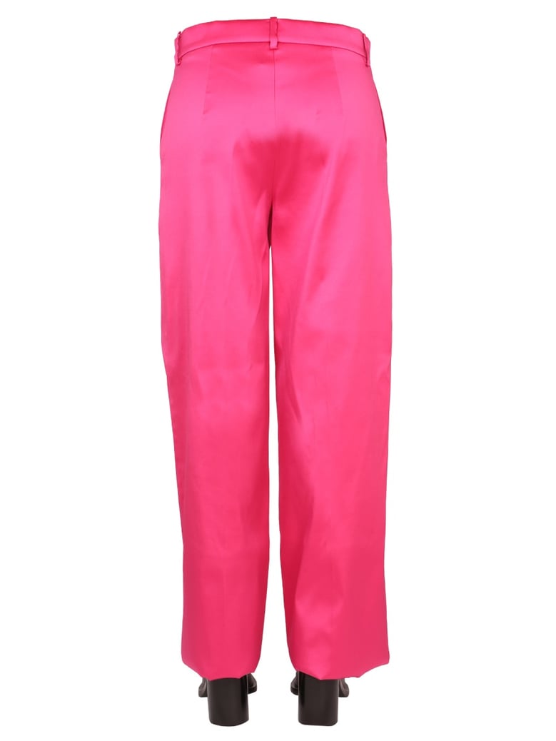 wide leg pants in fuchsia by Selfnex