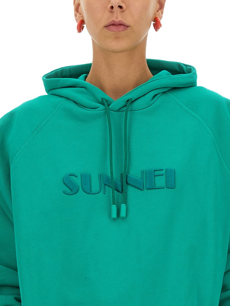 green sweatshirt with logo by Selfnex