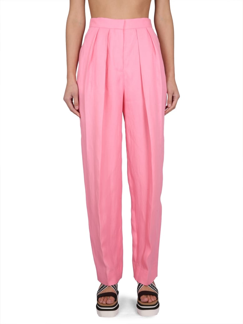 carrot fit pants in pink by Selfnex