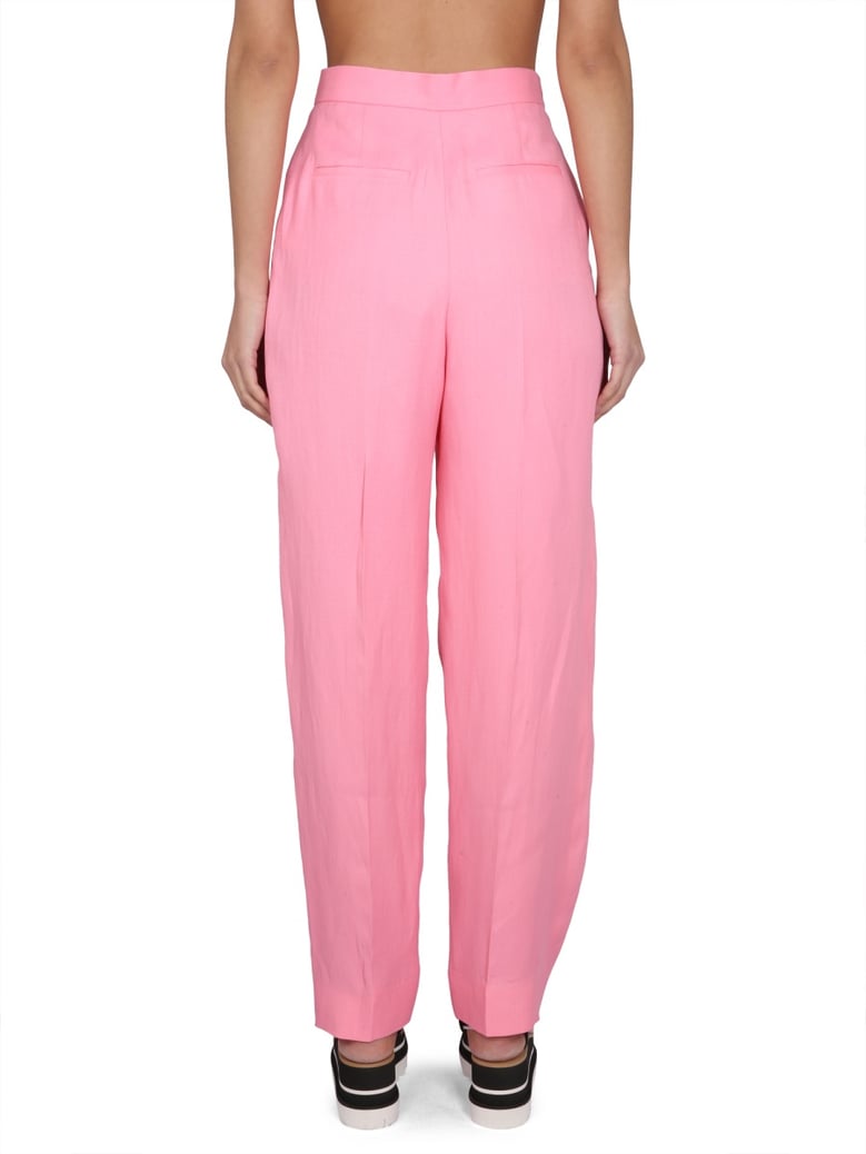 carrot fit pants in pink by Selfnex