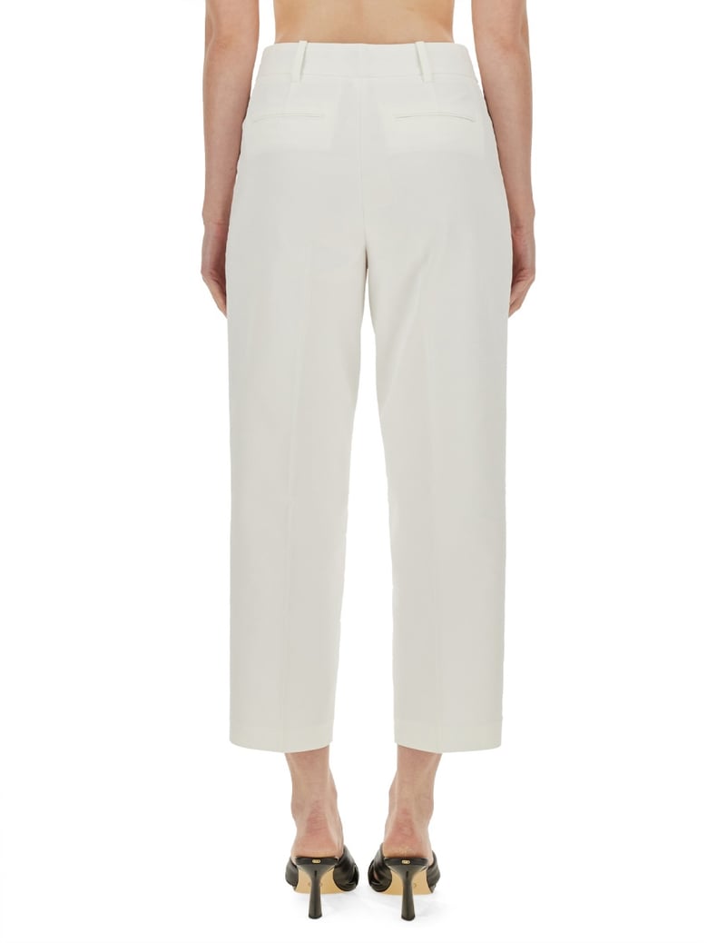 cropped pants in white by Selfnex