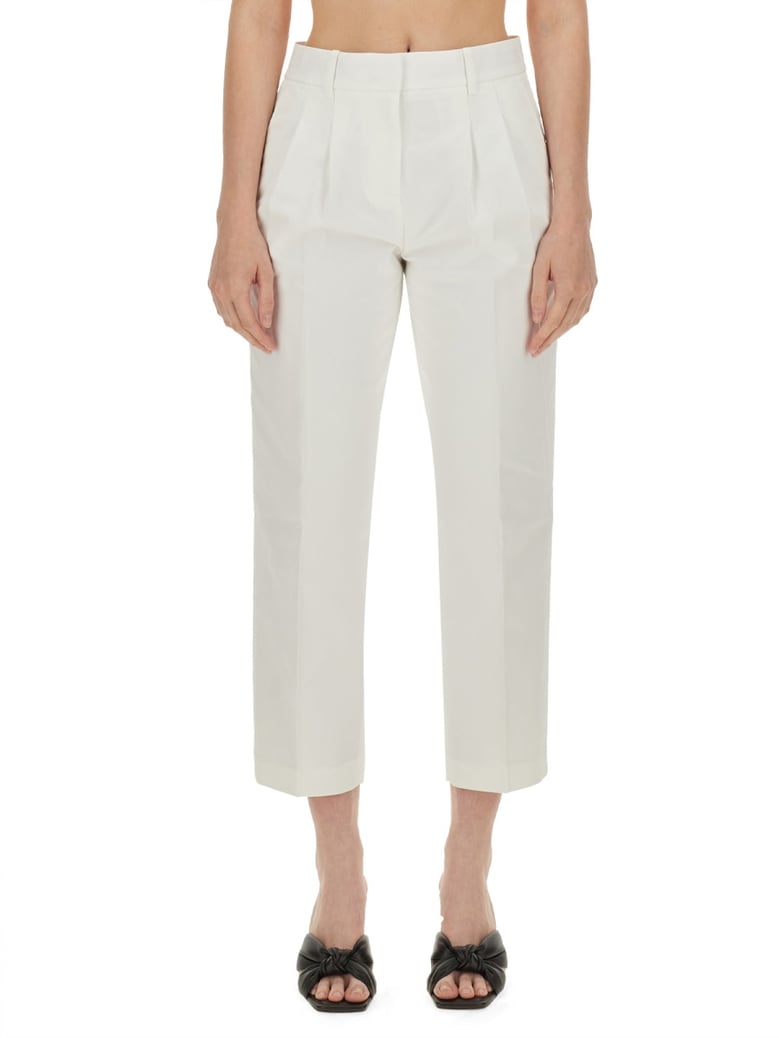 cropped pants in white by Selfnex