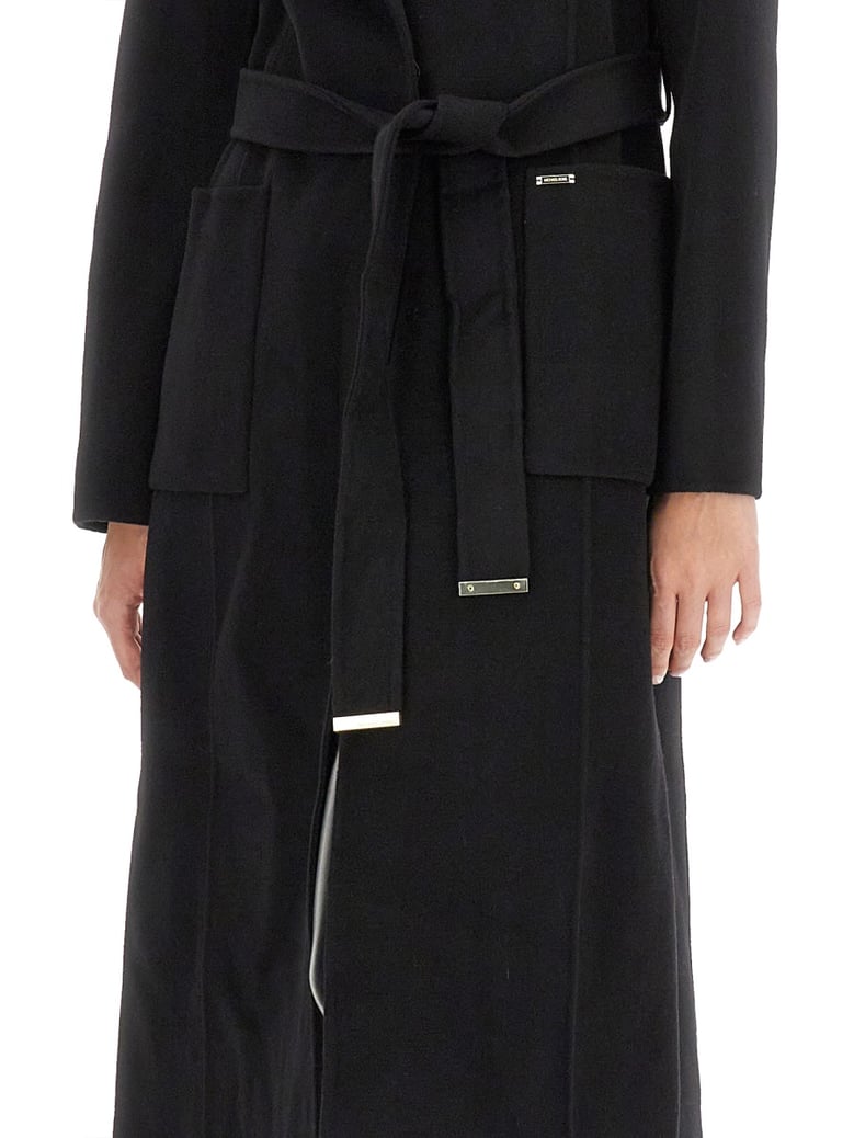 belted coat in black by Selfnex
