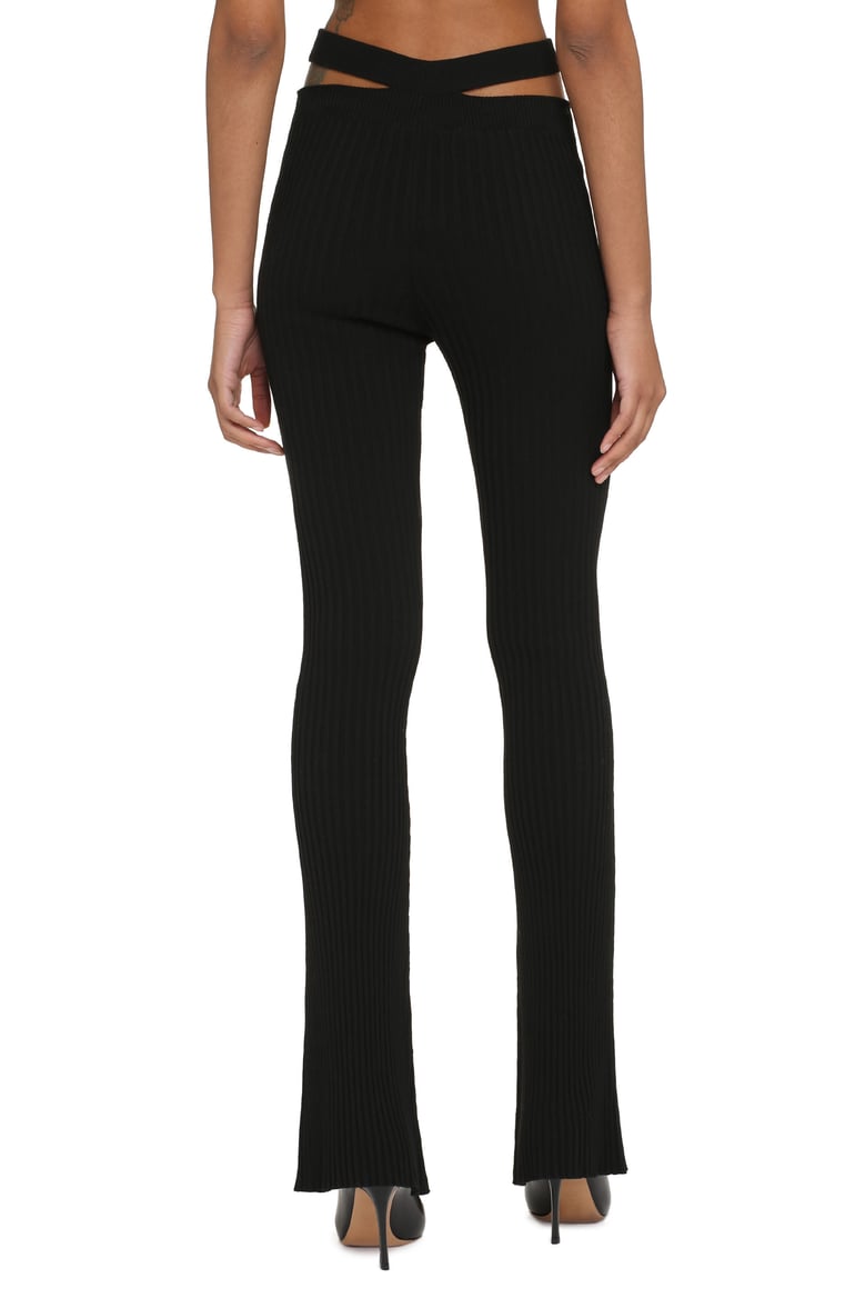 ribbed knit flared trousers by Selfnex
