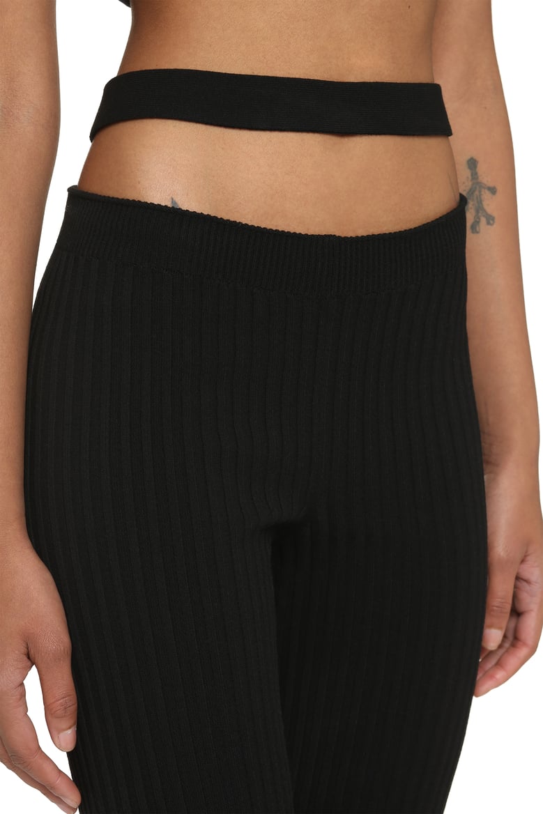 ribbed knit flared trousers by Selfnex