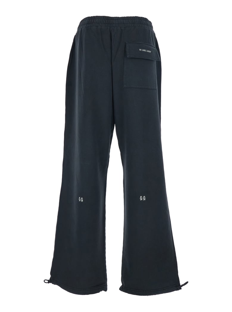black pants with elastic waist and drawstring hem by Selfnex