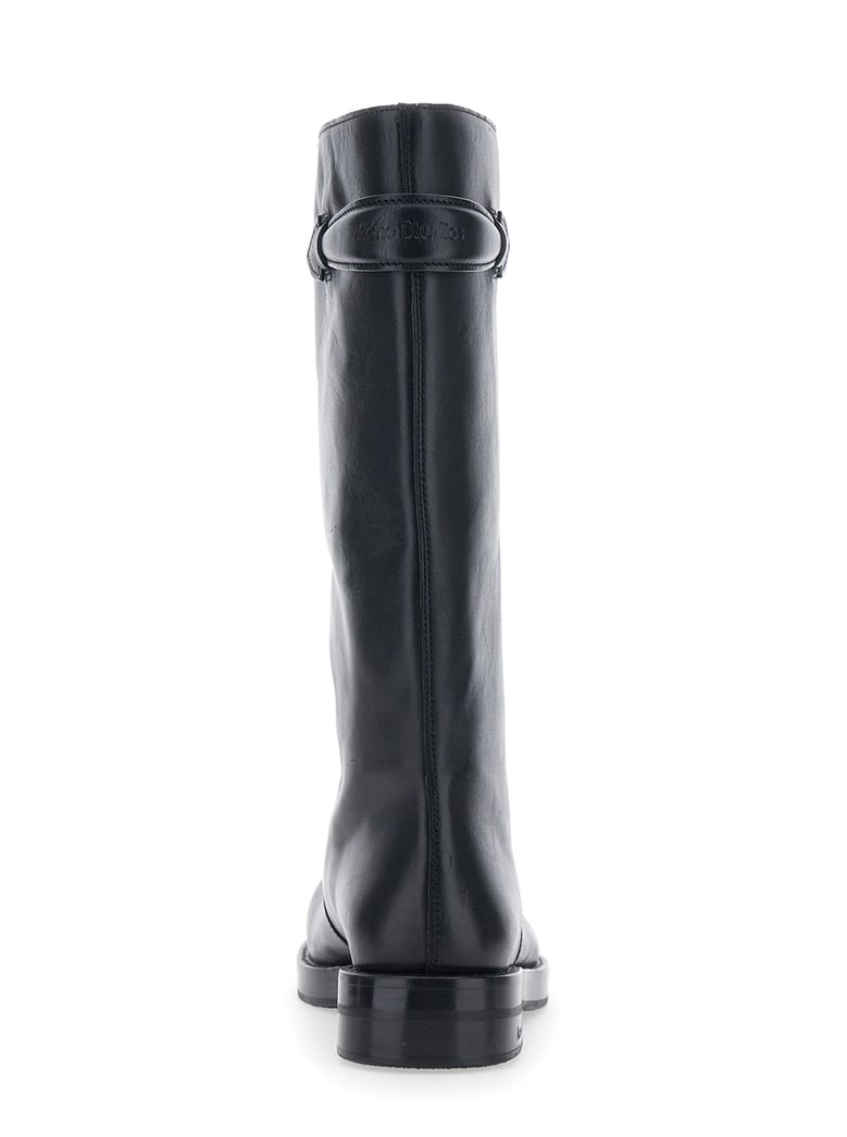 black leather boots with embossed logo by Selfnex
