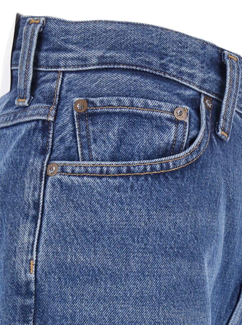 blue flared leg jeans with logo patch by Selfnex
