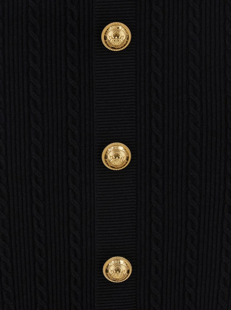 black skirt with logo buttons and zip closure by Selfnex