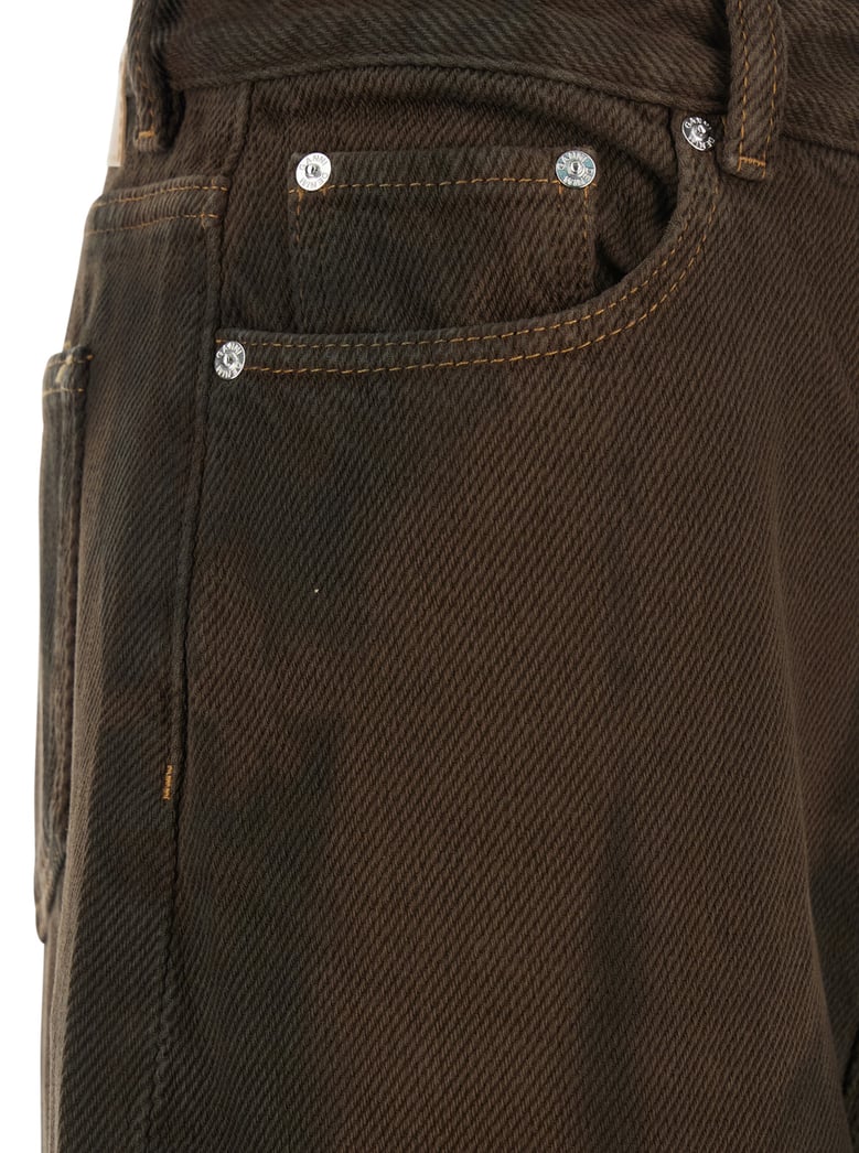 brown tie-dye patterned jeans by Selfnex
