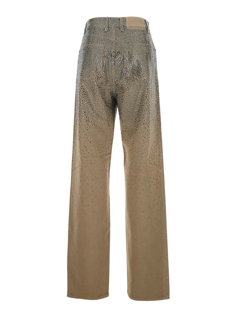 beige pants with crystal embellishment by Selfnex