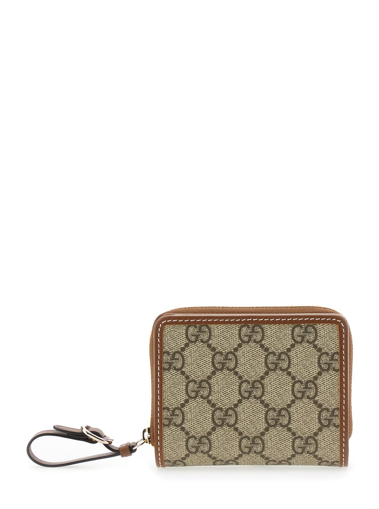 beige wallet with snap button and zip closure by Selfnex