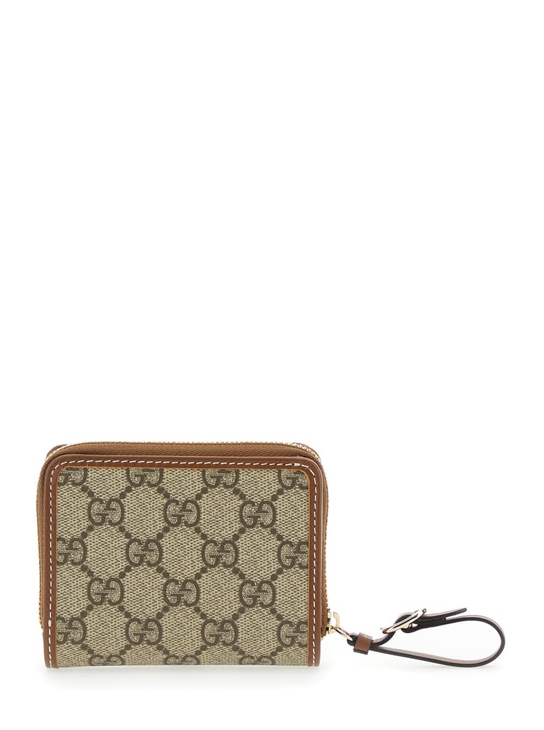 beige wallet with snap button and zip closure by Selfnex