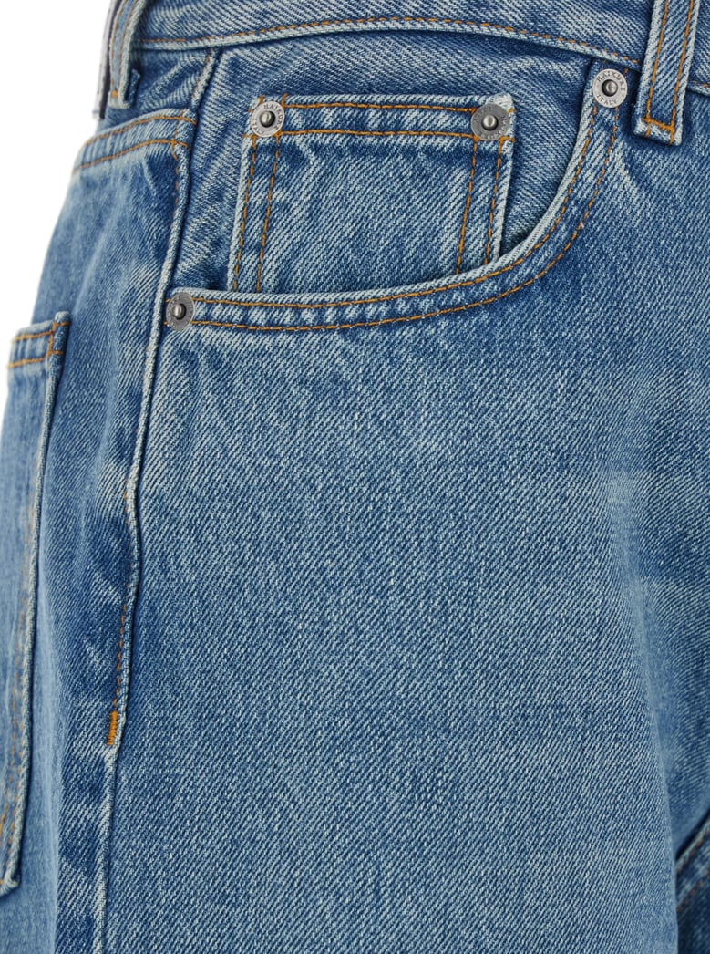 blue wide leg jeans with logo patch by Selfnex