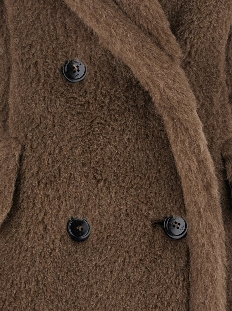 brown sleeveless coat with wide lapels by Selfnex
