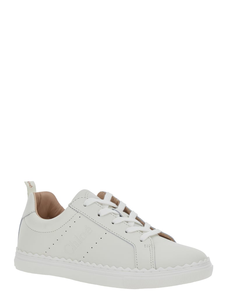 white low top sneakers with embossed logo by Selfnex