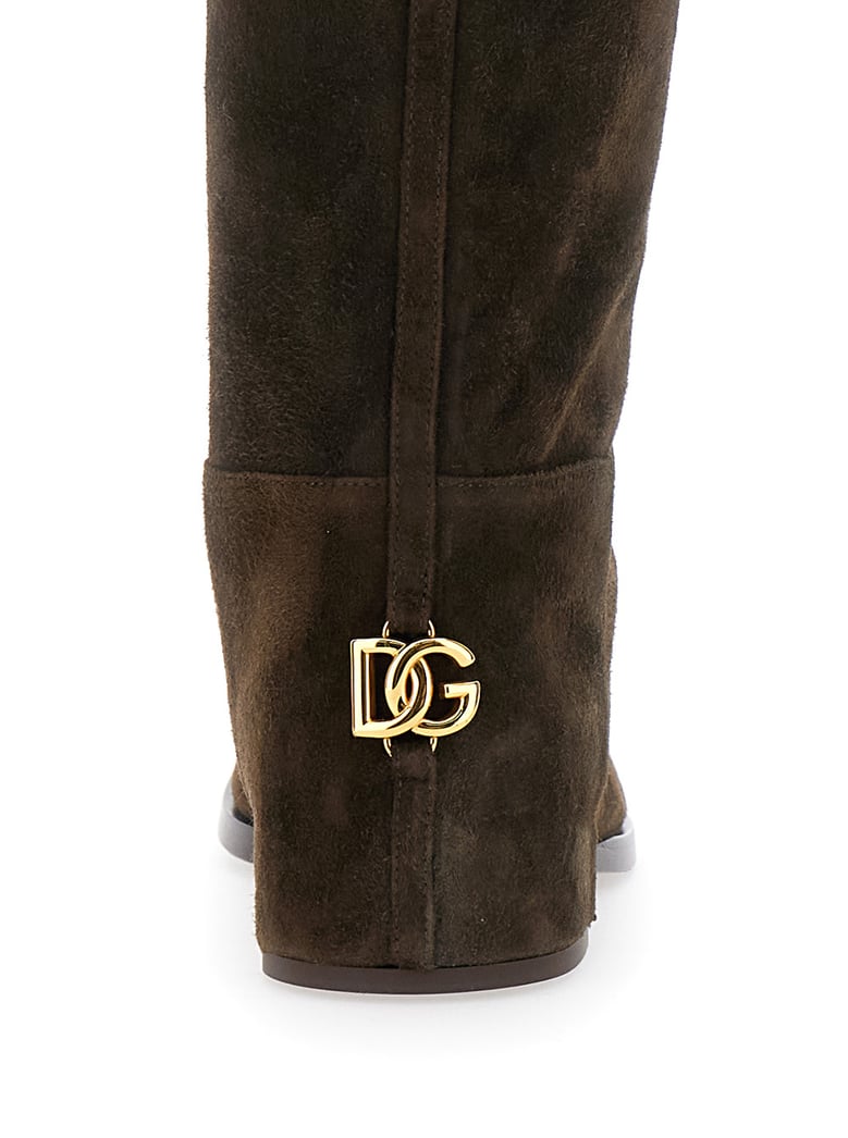 brown knee-high boots with logo plaque by Selfnex