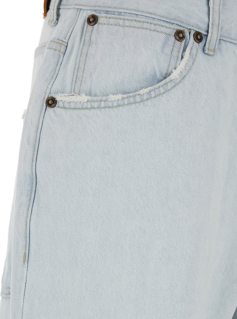 light blue jeans with ripped details by Selfnex