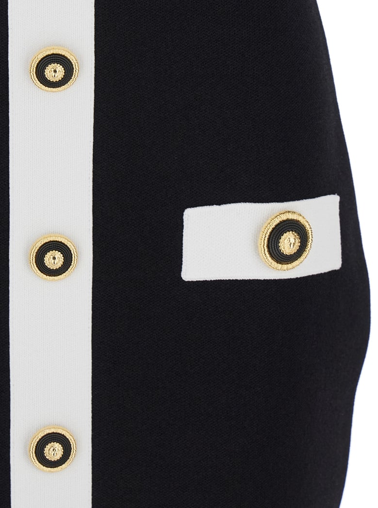 black dress with square neckline and decorative buttons by Selfnex