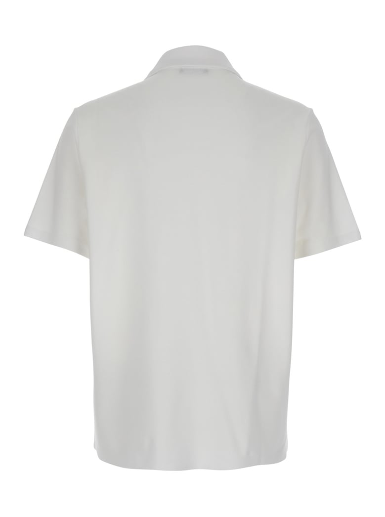 white polo shirt with coin print by Selfnex