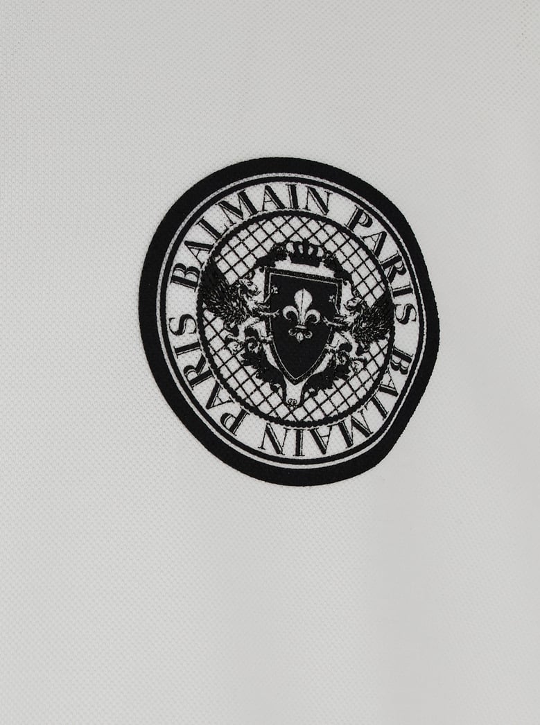 white polo shirt with coin print by Selfnex