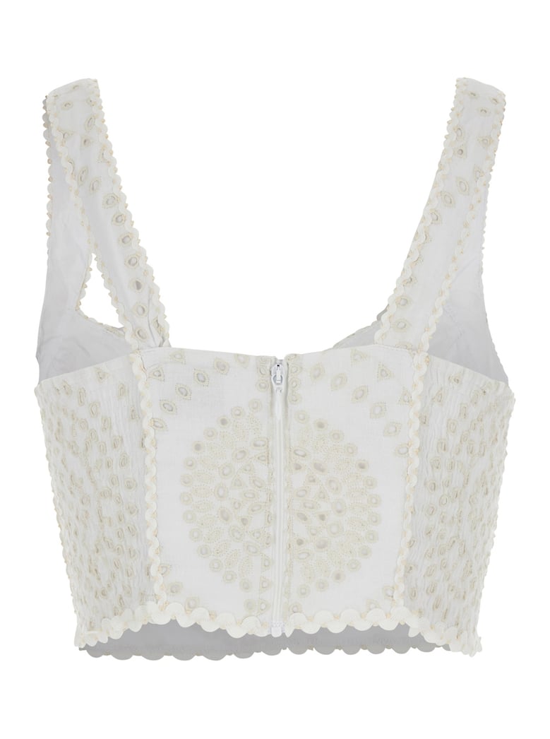 white top with v-neck and perforated design by Selfnex