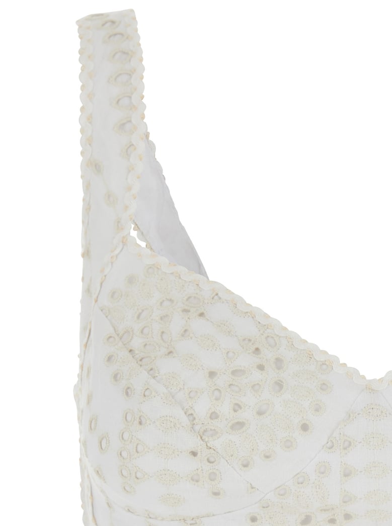 white top with v-neck and perforated design by Selfnex