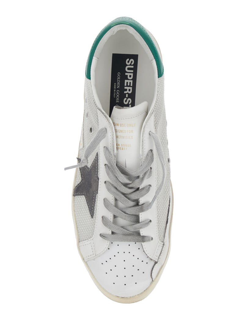 white low-top sneaker with star patch by Selfnex