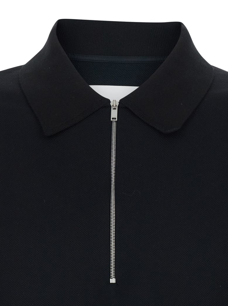 polo shirt with front zip in black by Selfnex