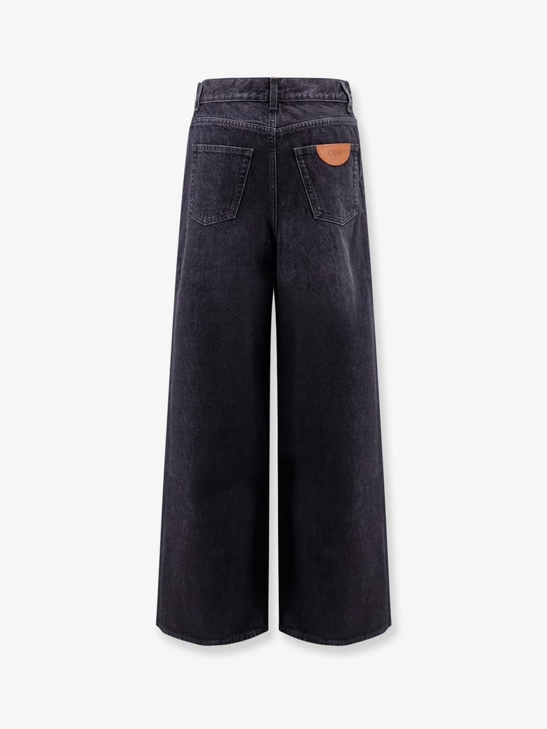 jeans with iconic leather logo tag by Selfnex
