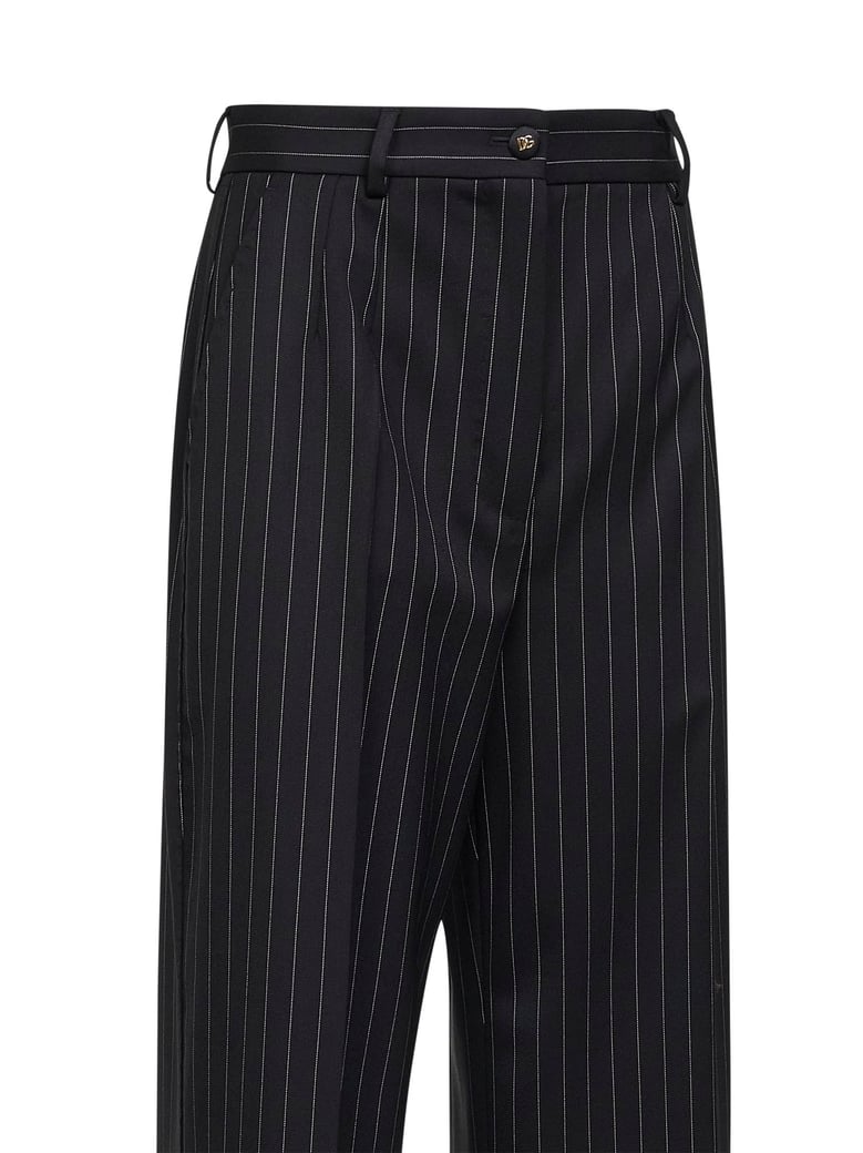 black two-way stretch twill pinstriped trousers by Selfnex