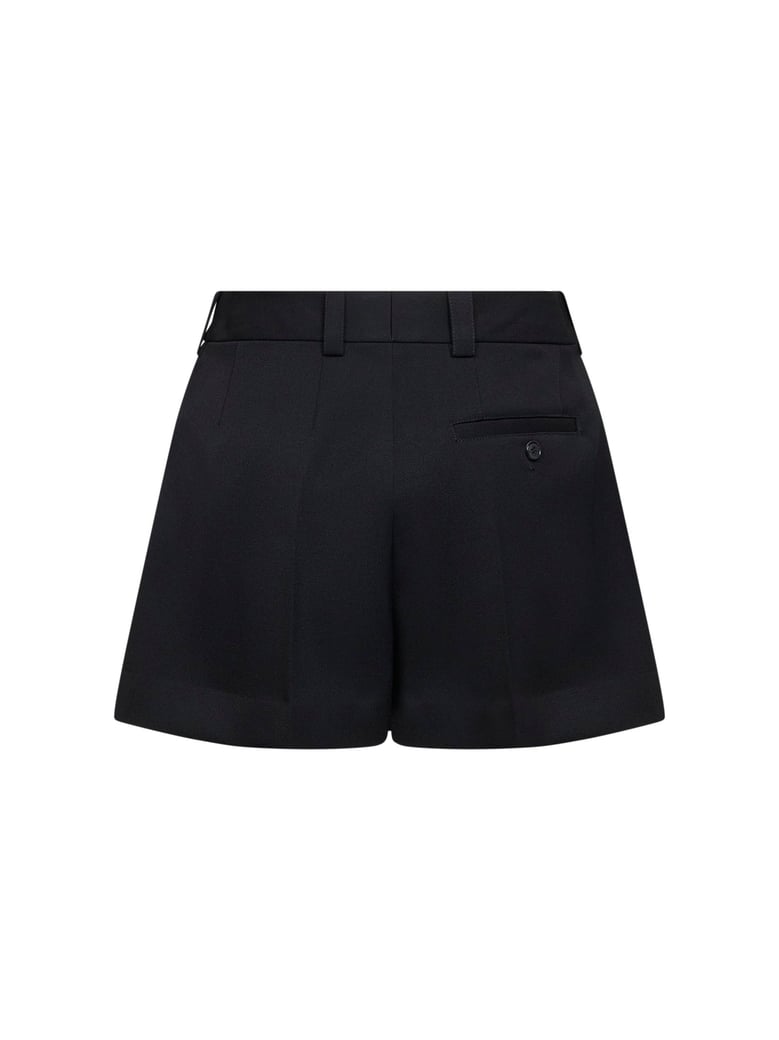black grain de poudre wool one-pleat shorts by Selfnex