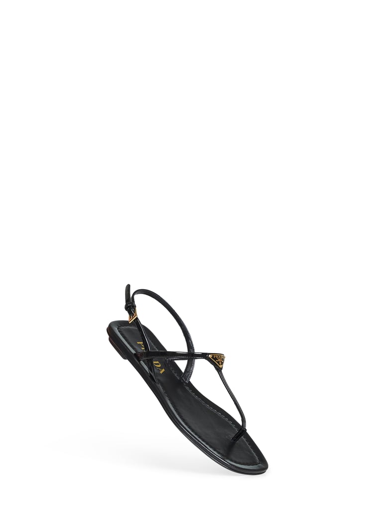 black patent leather thong sandals by Selfnex