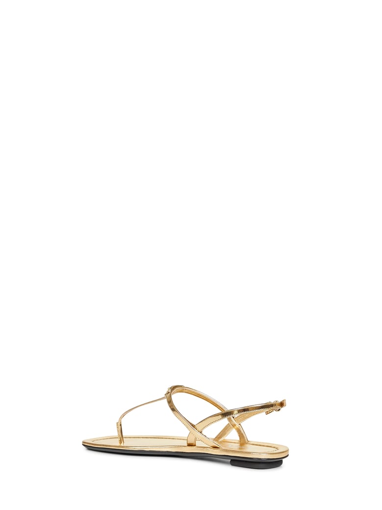 gold metallic leather thong sandals by Selfnex